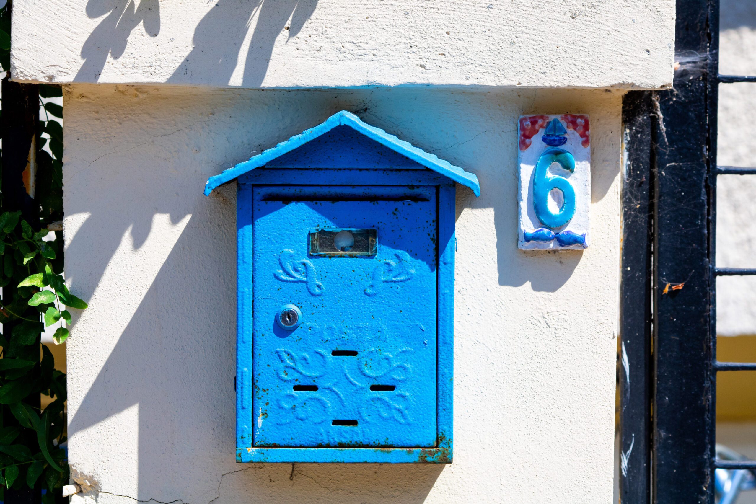 Blue and white wooden mail box